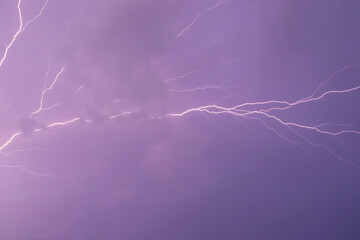 Lightning bolt, purple sky. Electric discharge in the atmosphere