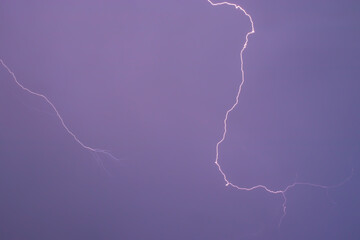 Lightning bolt, purple sky. Electric discharge in the atmosphere