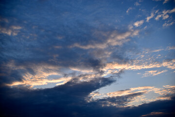 Evening cumulus red and blue clouds over the city