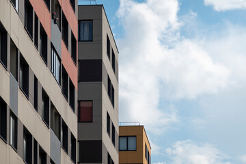 New modern residential apartment buildings with blue sky background. Abstract architecture details