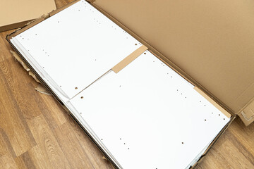 cardboard box, packaging with new furniture and fittings for assembly at home