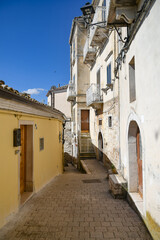 A narrow street between the old houses of Sant'Agata di Puglia, a medieval village in southern Italy.