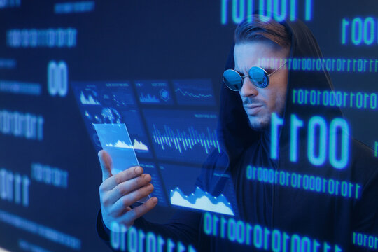 Man with futuristic tablet in hand. Guy using VR glasses. Augmented reality, future technology concept. Blue neon light. Futuristic holographic interface to display data.