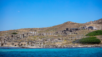 Greece. Delos island ancient civilization ruins at seaside Cyclades