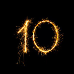 Sparkling number 10 isolated on black background