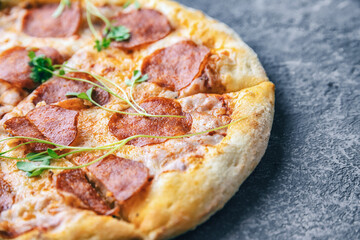 close-up pepperoni pizza on concrete surface