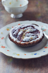 Plum pie on rustic stone background. Close up. 