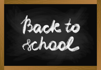School table blackboard in wood frame with chalk texture text back to school