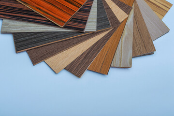 Obraz na płótnie Canvas Wood laminate concept. Layout of laminate flooring samples. Samples of color and texture of wood laminate.