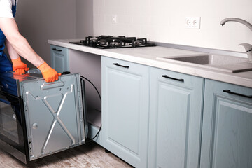  master installs an electric oven in  kitchen