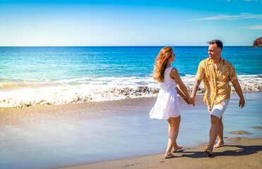 Happy young couple at the sea vacations