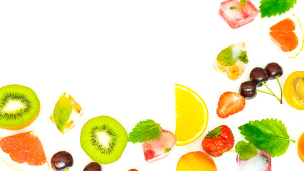 Mix of fresh juicy fruits, berries and ice on a white background. Image with selective focus
