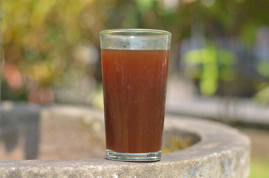 Iced Coffee in the glass refreshing look with blurred background. selective focus