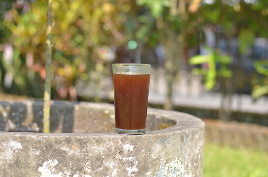 Iced Coffee in the glass refreshing look with blurred background. selective focus