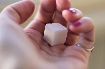sugar in a hand