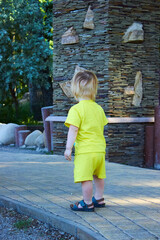 cute baby is playing in the park