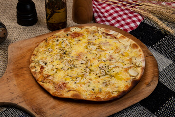 Brazilian pizza with mushroom, cheese and oregano