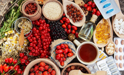 Medicinal plants and herbs composition - rosehips, oil, herbal tea, goji berries and chamomile 