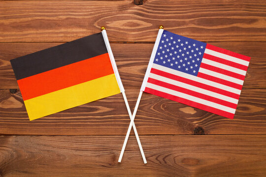 Flag of Germany and flag of USA crossed with each other. The image illustrates the relationship between countries. Photography for video news on TV and articles on the Internet and media.