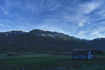 Wild mountains of Hemsedal. The nature is wild and the scenery is set. Golden hour light and dramatic sky. Country life here is not bad. 