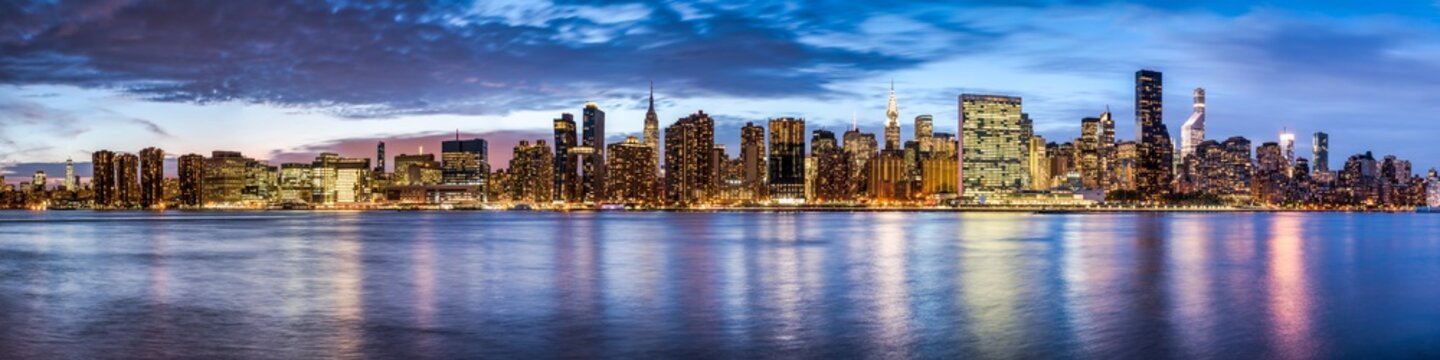Manhattan skyline panorama at night, New York City, USA