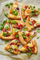 Vegetarian pizza portions on a white background, top view