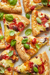 Vegetarian pizza portions on a white background, close up view
