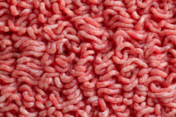 Minced meat with spices on table
