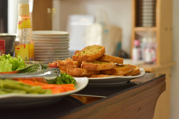 Western Food Dish Background with garlic bread, donuts, vegetables, french fries, slices fried chicken and slices beef steak