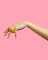 women's hand with cheese ring on finger