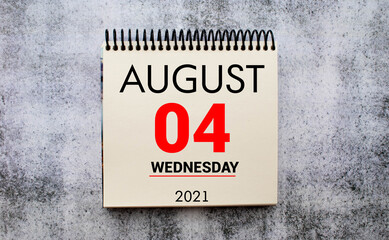 Save the Date written on a calendar - August 04