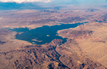 Fototapeta na wymiar Aerial View of Marina on Lake Meade With Large Mountains Peak next to it