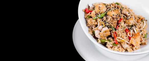 Panoramic view of oriental rice dish on black background