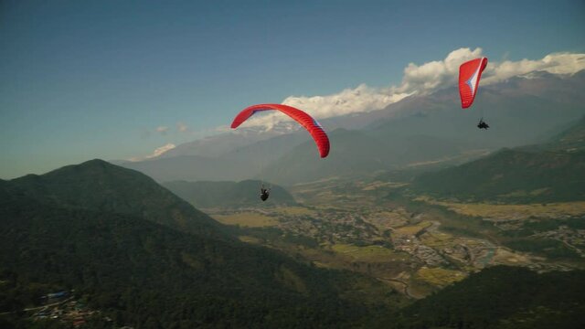 paragliding in the himalayan mountains 
