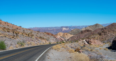 View of Single Two Way Road Through the NEvada Mountains With Clear Skies