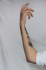 Tattooed arm with white background
