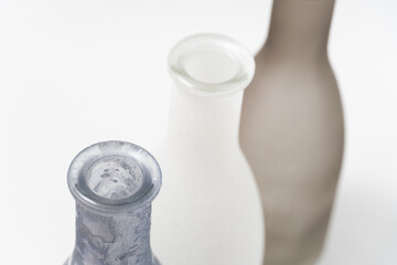 vases for flowers of gray shades on a white background