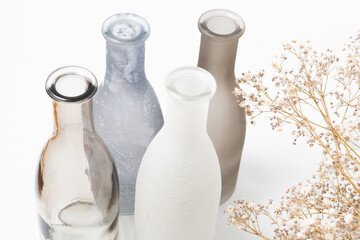 vases for flowers of gray shades on a white background