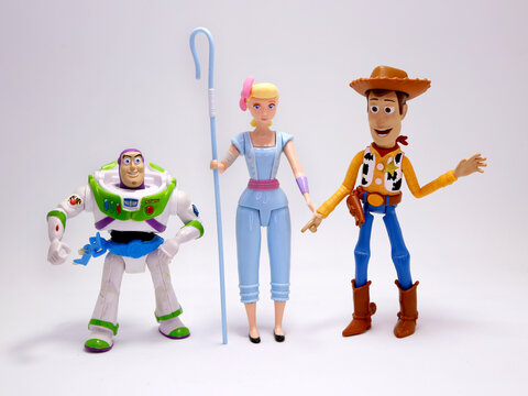 Toy Story movie. Woody, Bo Peep and Buzz Lightyear. Pixar and Disney movie toys. Cowboy, shepherd and astronaut. Porcelain doll of a night lamp. . I will be your faithful friend. Isolated white.