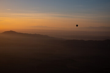 A photo of a hot air balloon taken from another hot air balloon in Marrakech, Morocco
