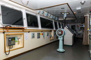 Navigational bridge on big cargo ship. Wheelhouse on vessel. © Alexey Seafarer