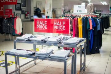 Sale sign in the clothing shop. Big discount because of the store closing. Discount outlet. Black friday, boxing day concept. Selective focus. Copy space.