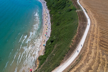 Italian coasts photographed with drone from above. It offers one of the most beautiful stretches of coast in Puglia, Italy with sandy beaches and clifs. Vacation and recreation sites 