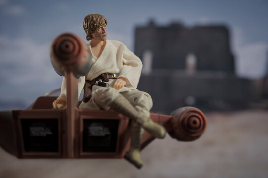 NEW YORK, USA - JUNE 12 2021: scene from Star Wars with Luke Skywalker and his land speeder at Tosche Station, Tatooine - Hasbro action figure