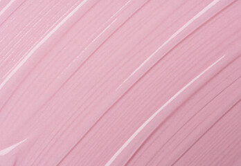 Serum texture on transparent liquid gel background with pink background.