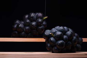 Large Grapes On A Board On A Black Background.
A variety called Nagano Purple