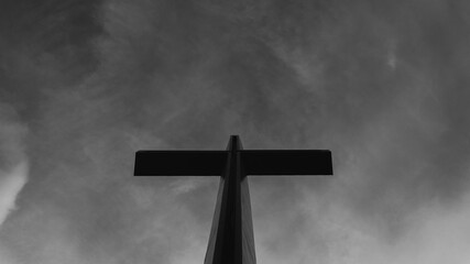 Black and white cross with dramatic sky