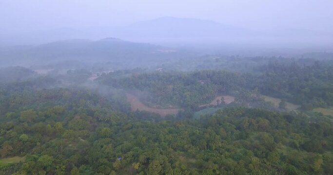 Flying Over Misty Rainforest With Thicket Woods And Vegetation At Countryside Near Cotigao Wildlife Sanctuary In Goa, India. - Aerial Wide Shot