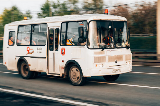 PAZ 3205 is a common Soviet midibus model made by the Pavlovo Bus Factory. White passenger small bus in motion outdoors
