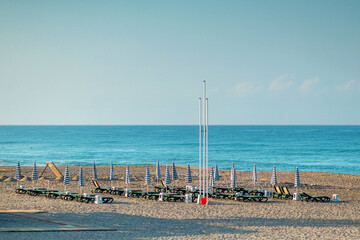 Morning beach, lounge chairs for recreation, sea. Concept vacation, rest, walking on the ship